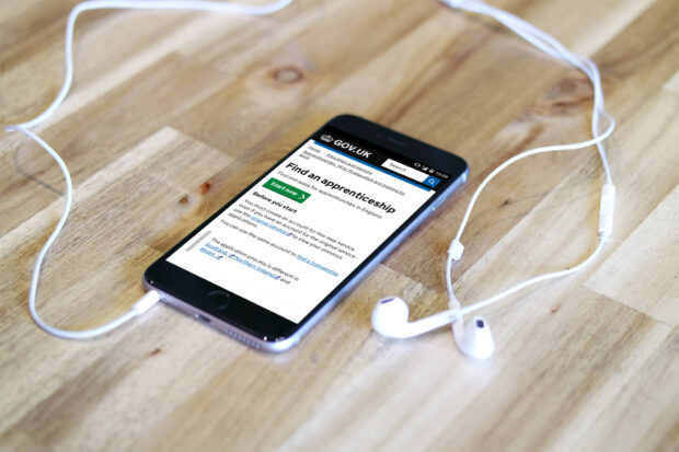 mobile phone on table  showing Find an apprenticeship website page