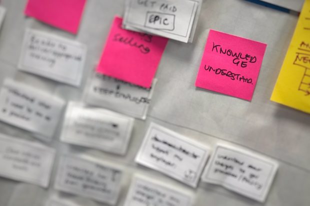 user research post-it notes zoomed in on one post-it - knowledge understanding