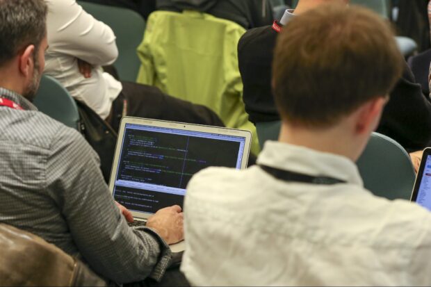 Group of people participating at a coding hack day