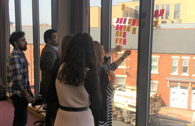 A daily stand up meeting taking place with NCS staff